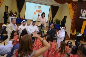 The winner Hou Yifan, Sheikh Saud Abdulaziz and the management of Sharjah Hall, the world's biggest chess club 